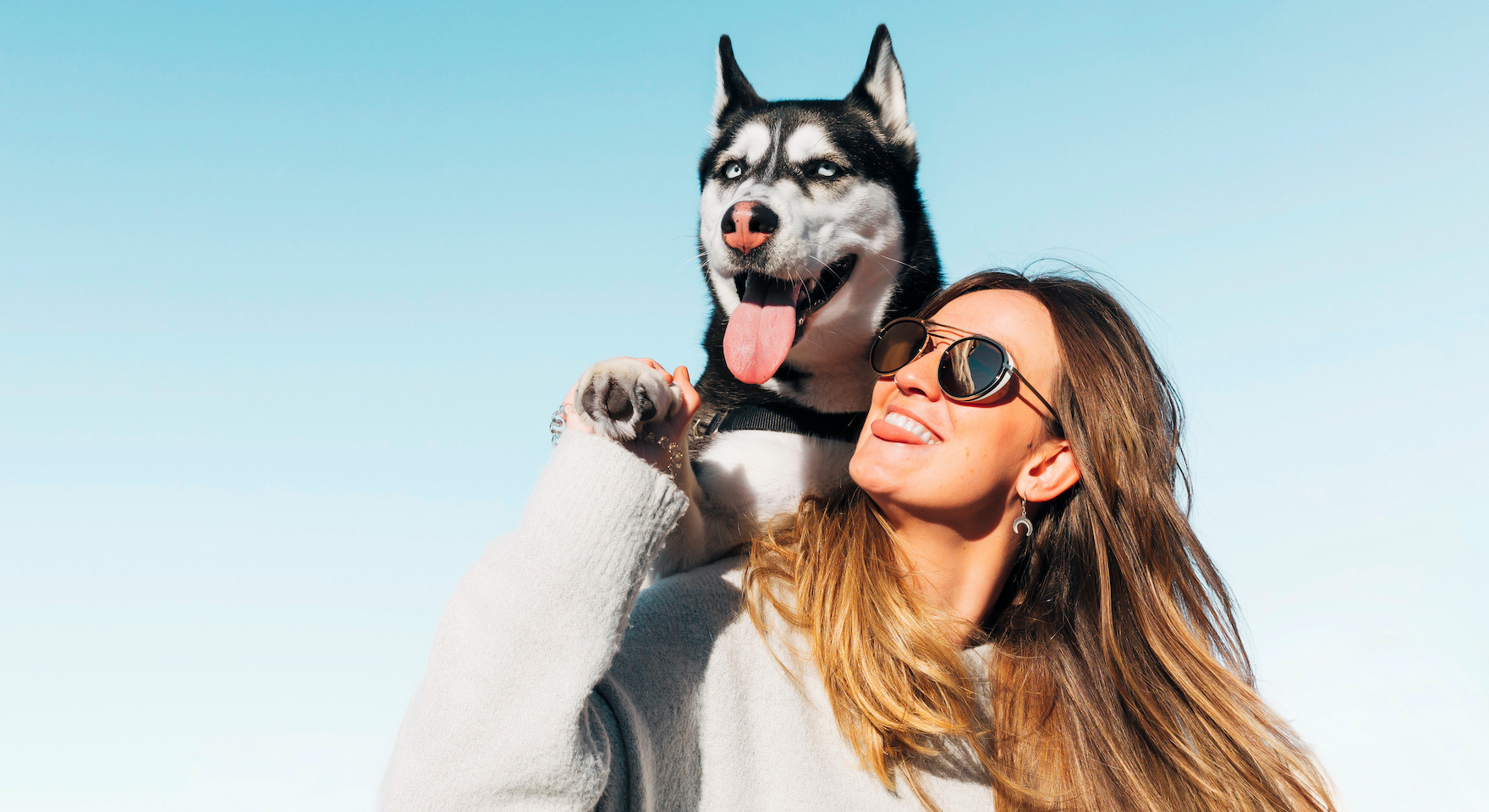 a woman smile to a dog